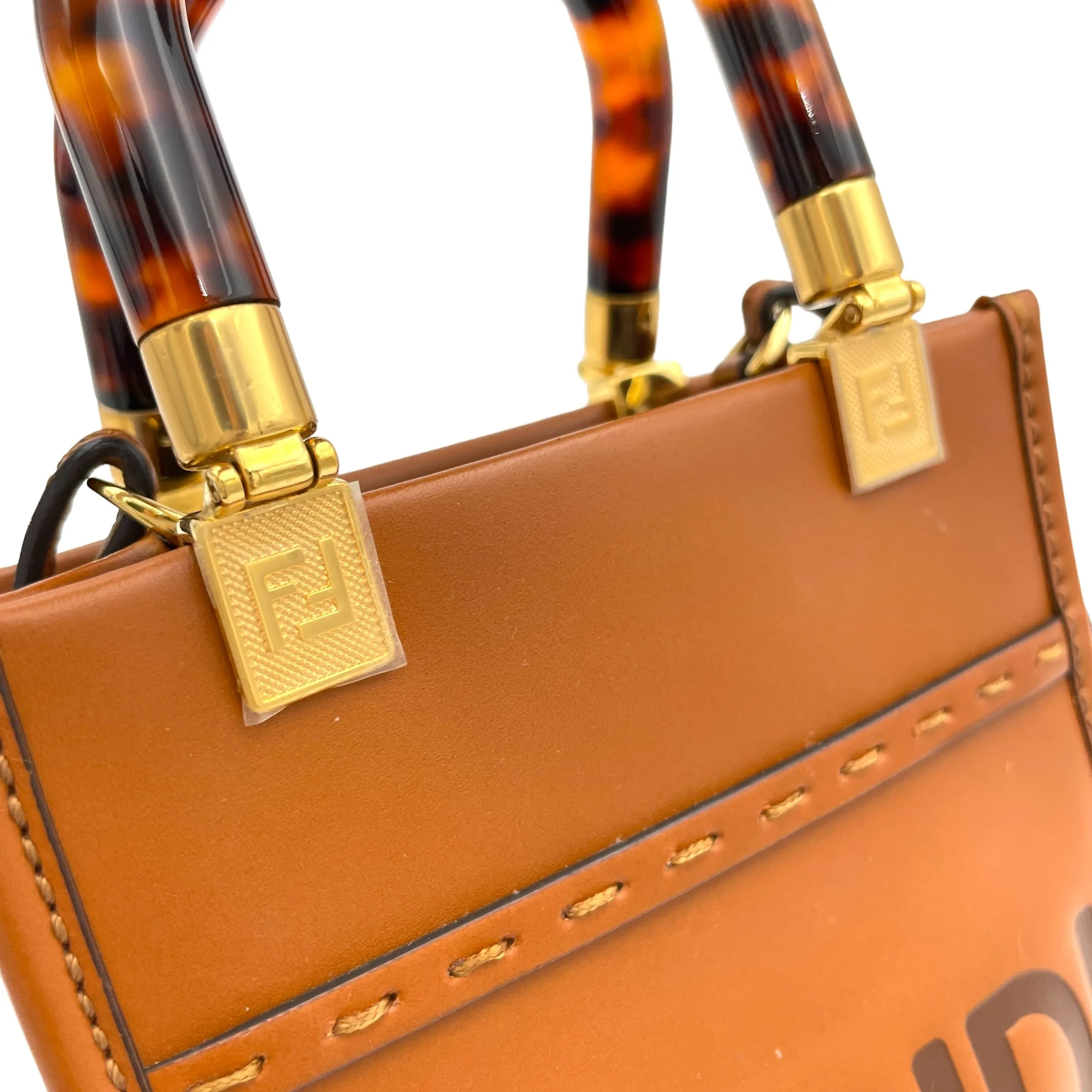 Sunshine Shopper Mini Brown Top Handle Bag in Calfskin, Gold hardware